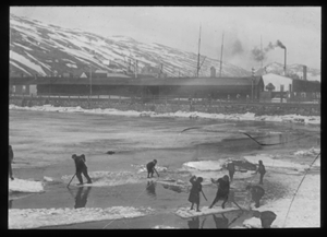Image of Men on ice floes, pushing with poles